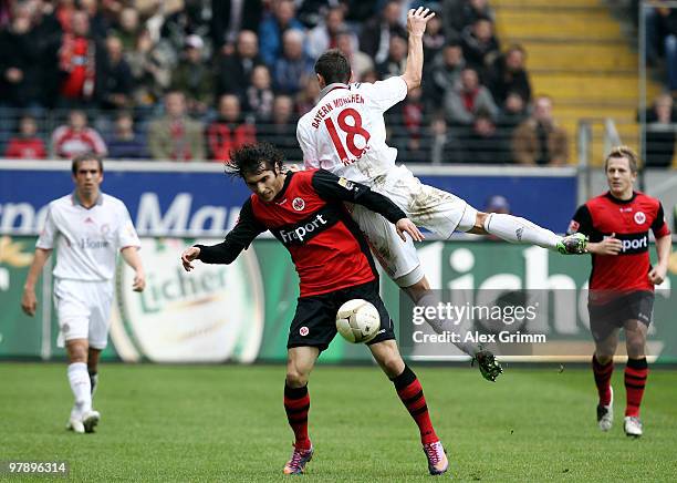 Halil Altintop of Frankfurt and Miroslav Klose of Muenchen jump for a header during the Bundesliga match between Eintracht Frankfurt and Bayern...