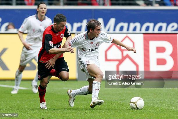 Philipp Lahm of Muenchen and Benjamin Koehler of Frankfurt battle for the ball during the Bundesliga match between Eintracht Frankfurt and Bayern...