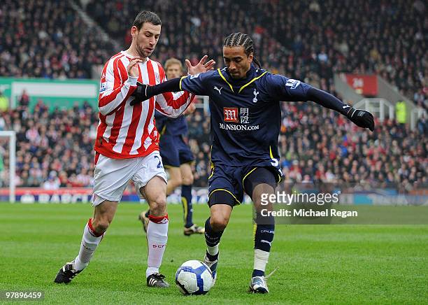 Rory Delap of Stoke battles Benoit Assou-Ekotto of Tottenham during the Barclays Premier League match between Stoke City and Tottenham Hotspur at the...