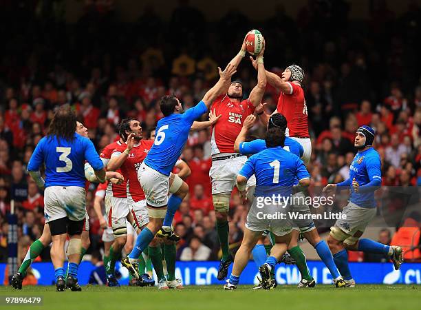 Welsh locks Bradley Davies and Luke Charteris of Wales win the ball during the RBS Six Nations Championship between Wales and Italy at Millennium...