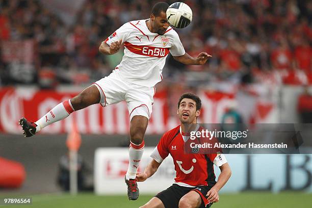 Cacau of Stuttgart battles for the ball with Karim Haggui of Hannover during the Bundesliga match between VfB Stuttgart and Hannover 96 at...