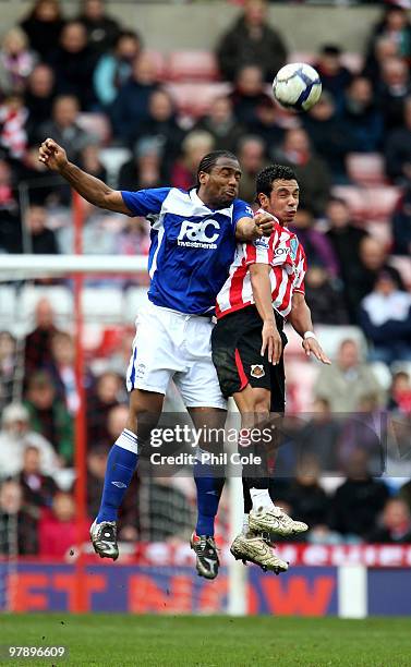 Kieran Richardson of Sunderland goes up for the ball against Cameron Jerome of Birmingham City during the Barclays Premier League match between...