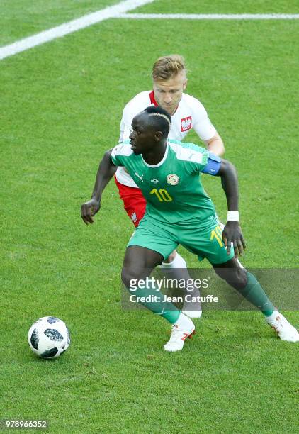 Sadio Mane of Senegal, Jakub Baszczykowski of Poland during the 2018 FIFA World Cup Russia group H match between Poland and Senegal at Spartak...