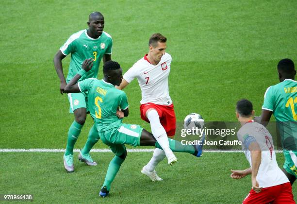 Kalidou Koulibaly, Idrissa Gueye of Senegal, Arkadiusz Milik of Poland during 2018 FIFA World Cup Russia group H match between Poland and Senegal at...