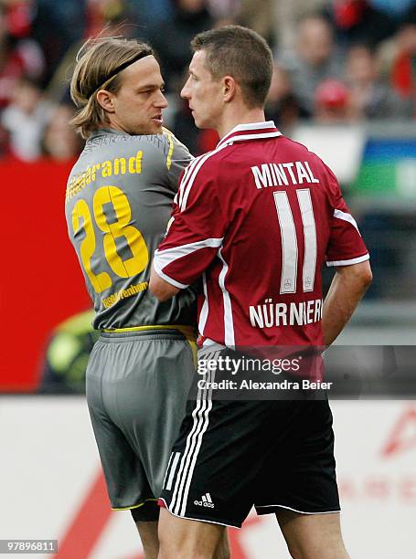 Marek Mintal of Nuernberg discusses with goalkeeper Timo Hildebrand of Hoffenheim during the Bundesliga match between 1. FC Nuernberg and 1899...