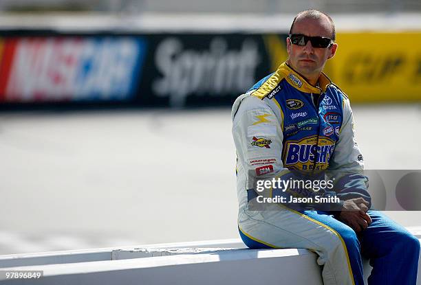 Marcos Ambrose, driver of the Bush' Best Toyota, sits on pit road wall during practice for the NASCAR Sprint Cup Series Food City 500 at Bristol...