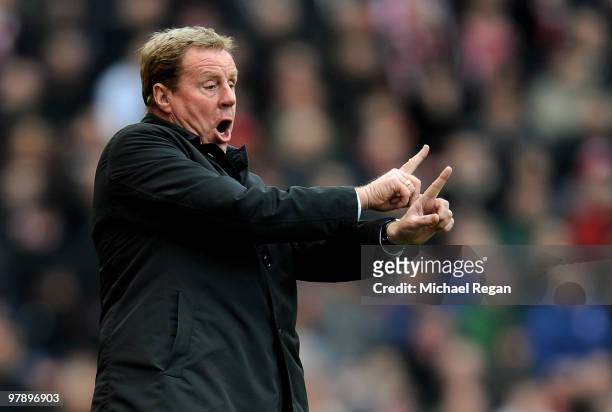 Spurs manager Harry Redknapp gestures instructions to his players during the Barclays Premier League match between Stoke City and Tottenham Hotspur...