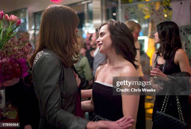 Model Helena Christensen and actress Mena Suvari attend the flagship store opening of Odd Molly Boutique on March 19, 2010 in Los Angeles, California.