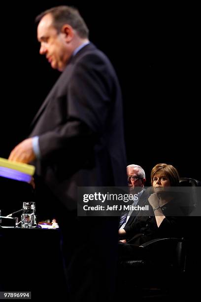 Nicola Sturgeon listens to Alex Salmond Scottish National Party leader giving his key note speech at the party conference on March 20, 2010 in...