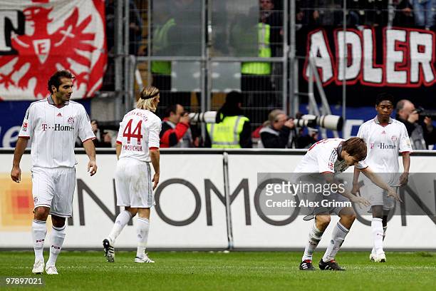Hamit Altintop, Anatoliy Tymoshchuk, Holger Badstuber and David Alaba of Muenchen react after Frankfurt's first goal during the Bundesliga match...