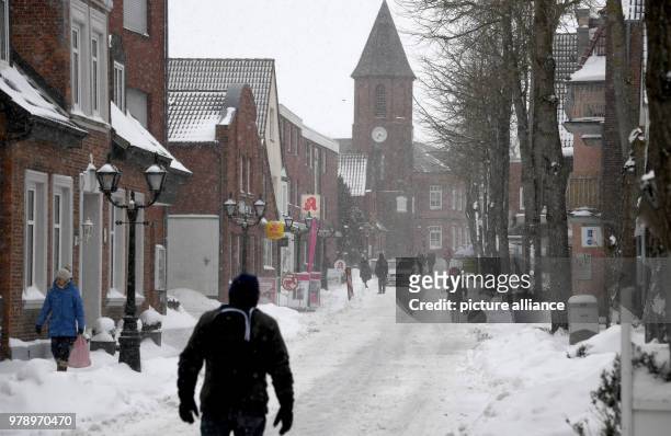 Dpatop - 01 March 2018, Germany, Wyk: Pedestrian zone in Wyk looking like a winter sport location. The north sea island Foehr has not seen this much...