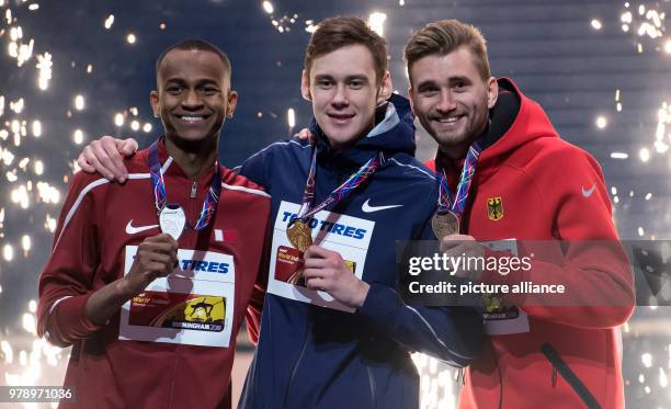 Dpatop - Qatari silver medallist Mutaz Essa Barshim , Russian gold medallist Danil Lysenko and German bronze medallist Mateusz Przybylko celebrate...