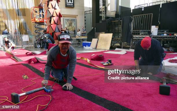 March 2018, USA, Los Angeles: Set up work at the red carpet for the Governors Ball at the Dolby Theatre, the traditional Academy Awards Party. The...