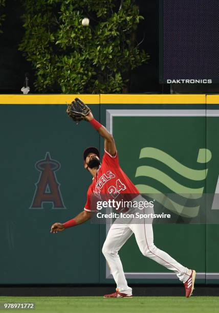 Los Angeles Angels of Anaheim center fielder Chris Young gets under a fly ball on the warning track in the fifth inning of a game against the Arizona...