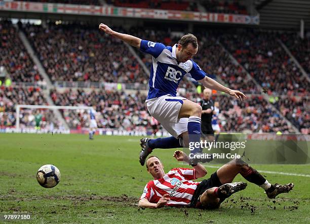 James McFadden of Birmingham City gets tackled by David Meyler of Sunderland during the Barclays Premier League match between Sunderland and...