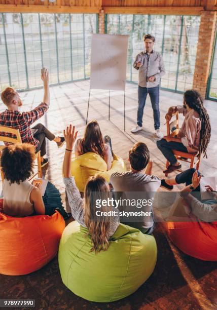 engaging presentation at casual board room! - training bean bag stock pictures, royalty-free photos & images