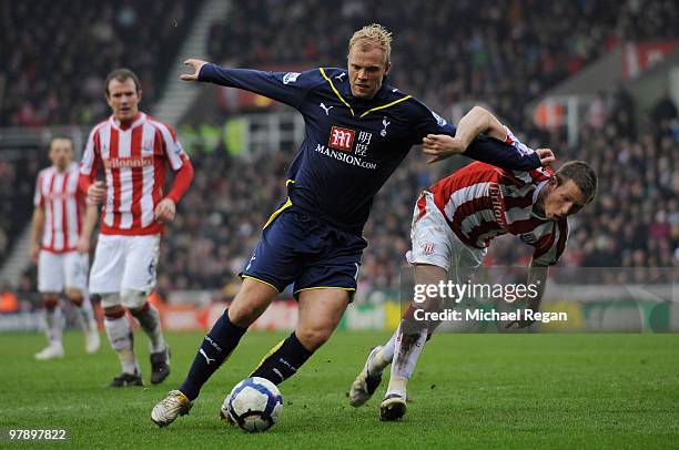 Eidur Gudjohnsen of Tottenham battles Danny Collins of Stoke during the Barclays Premiership match between Stoke City and Tottenham Hotspurs at the...