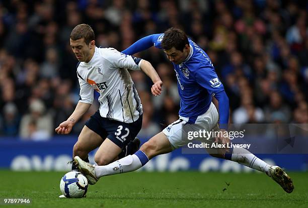 Jack Wilshere of Bolton Wanderers beats Diniyar Bilyaletdinov of Everton during the Barclays Premier League match between Everton and Bolton...