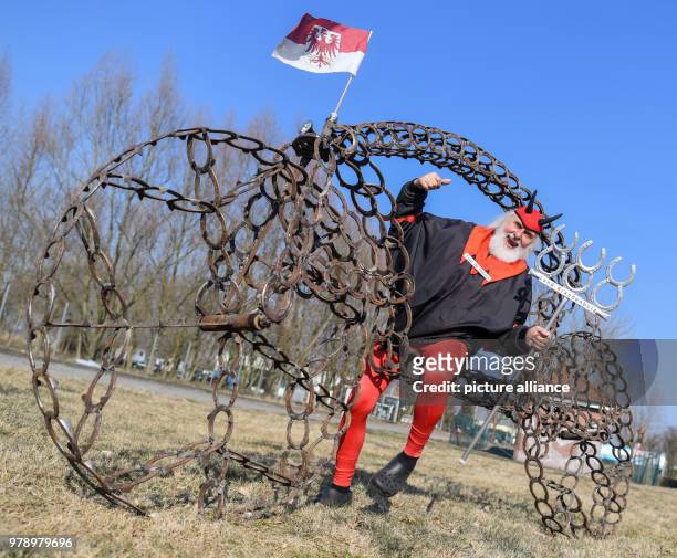 Dpatop - 02 March 2018, Germany, Storkow: Bicycle designer Dieter 'Didi' Senft presents a velocipede consisting of horseshoe. Didi welded the more...