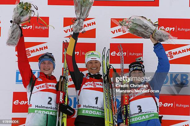Darya Domratcheva of Belarus , Simone Hauswald of Germany and Anna Carin Olofsson-Zidek of Sweden celebrate after the women's pursuit in the E.On...