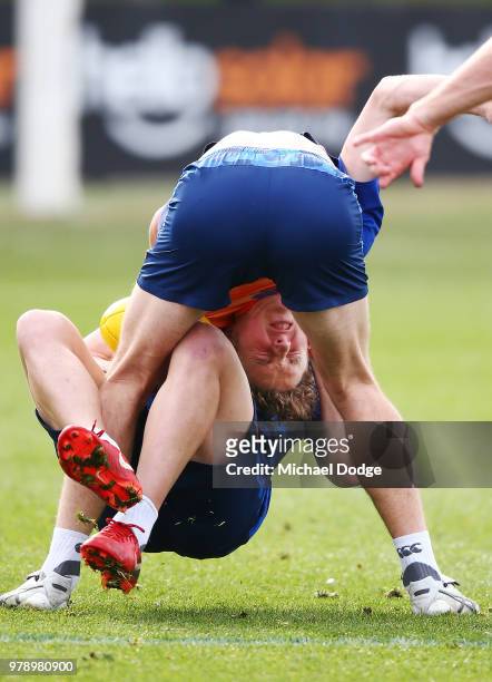 Nick Larkey, a possible inclusion this weekend for the injured Jarrad Waite, gets tackled by Jy Simkin during a North Melbourne Kangaroos AFL...