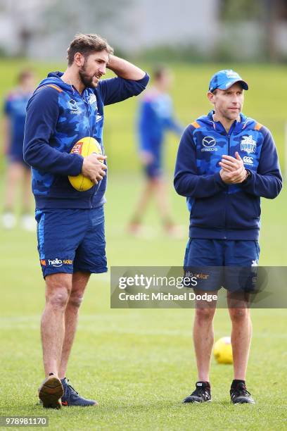 Jarrad Waite of the Kangaroos speaks to a physician moments after he announced that he was missing from this weekend due to a lower leg injury during...