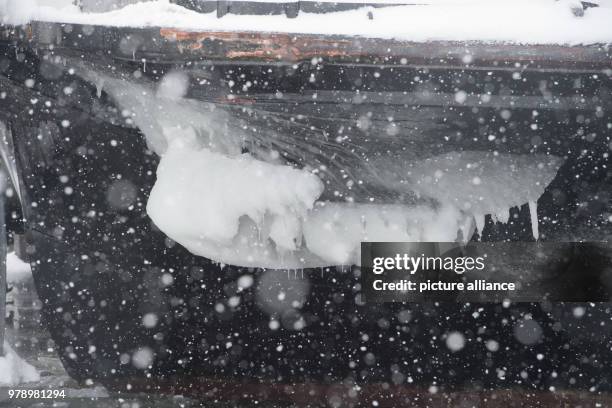 March 2018, Germany, Schaprode: The ferry "Vitte" driving on the ice covered Bodden near the island Ruegen. The Hiddensee shipping company is driving...