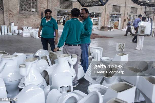 Employees checks toilets with defects at the HSIL Ltd. Factory in Bahadurgarh, Haryana, India, on Monday, June 11, 2018. Indian Prime Minister...