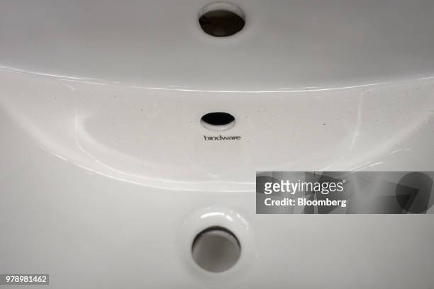 Hindware branding is displayed on wash basin at the HSIL Ltd. Factory in Bahadurgarh, Haryana, India, on Monday, June 11, 2018. Indian Prime Minister...