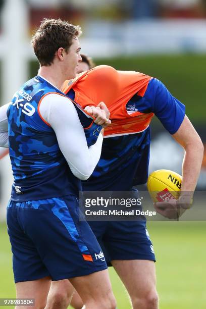Nick Larkey, a possible inclusion this weekend for the injured Jarrad Waite, gets tackled during a North Melbourne Kangaroos AFL training session at...