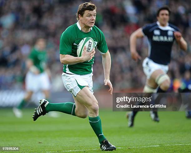 Brian O'Driscoll of Ireland breaks away to score the opening try during the RBS Six Nations match between Ireland and Scotland at Croke Park on March...