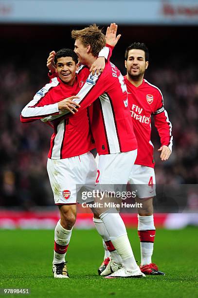 Denilson of Arsenal celebrates scoring the opening goal with Nicklas Bendtner and Cesc Fábregas during the Barclays Premier League match between...