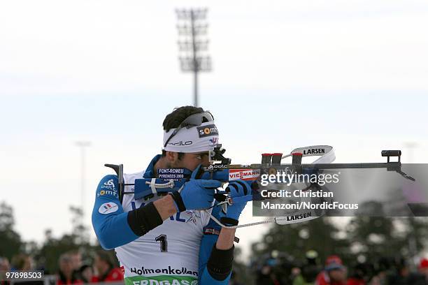 Race winner Martin Fourcade of France shoots during the men's pursuit in the E.On Ruhrgas IBU Biathlon World Cup on March 20, 2010 in Oslo, Norway.