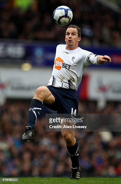 Kevin Davies of Bolton Wanderers eyes the ball during the Barclays Premier League match between Everton and Bolton Wanderers at Goodison Park on...