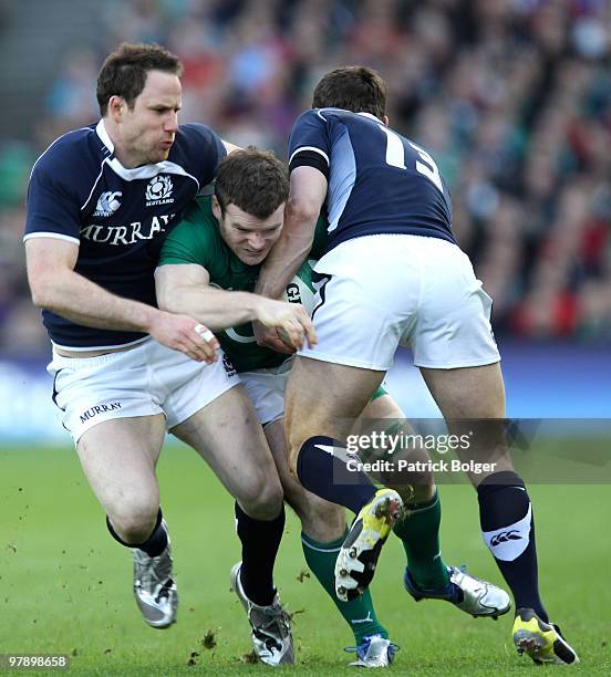 Gordon D'Arcy of Ireland and Graeme Morrison and Nick De Luca of Scotland during the RBS Six Nations match between Ireland and Scotland at Croke Park...