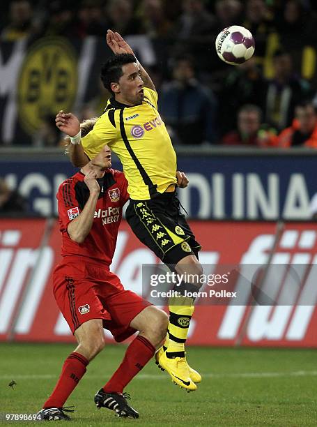 Lucas Barrios of Dortmund and Sami Hyypiae of Leverkusen compete for the ball during the Bundesliga match between Borussia Dortmund and Bayer...