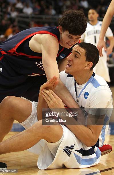 Maurice Sutton of the Villanova Wildcats calls a time out as Clint Stiendl of the Saint Mary's Gaels tries to get the loose ball during the second...