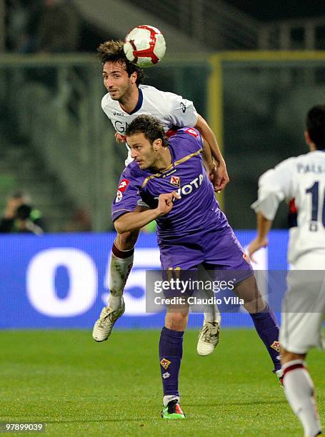 Alberto Gilardino of ACF Fiorentina competes for the ball with Emiliano Moretti of Genoa CFC during the Serie A match between ACF Fiorentina and...