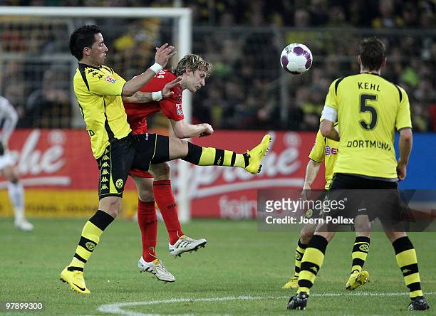 Lucas Barrios of Dortmund and STefan Kiessling of Leverkusen compete for the ball during the Bundesliga match between Borussia Dortmund and Bayer...