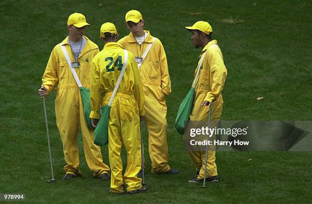 Volunteer litter collectors keep the course clean during Wednesday's practice round at the 2001 Masters at the Augusta National Golf Club, Augusta,...