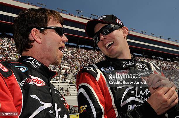Kyle Busch , driver of the Z-Line Designs Toyota, talks with crew chief Jason Ratcliff prior to the start of the NASCAR Nationwide Series Scotts Turf...