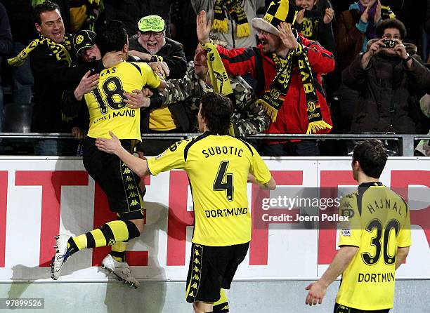 Lucas Barrios of Dortmund celebrates with the fans after scoring his team's first goal during the Bundesliga match between Borussia Dortmund and...