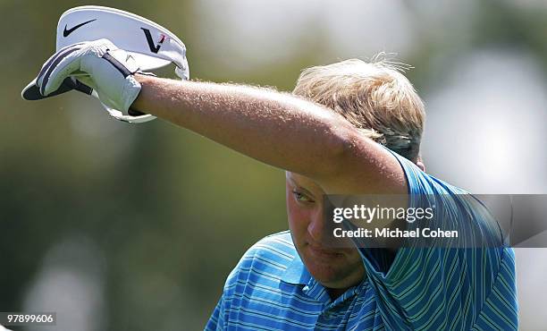 Carl Pettersson of Sweden wipes his brow on the second hole during the third round of the Transitions Championship at the Innisbrook Resort and Golf...