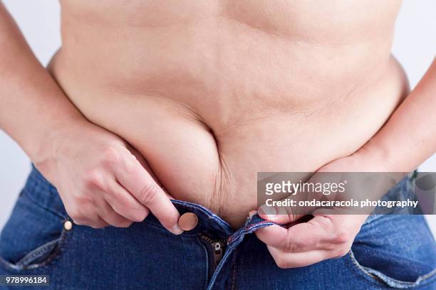 a woman torso with overweight - fat hips stock pictures, royalty-free photos & images