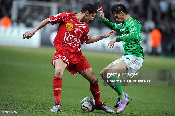 Nancy Morocco defender Mickael Chrétien vies with Saint-Etienne Belgian forward Kevin Mirallas during the French L1 football match Saint-Etienne vs...