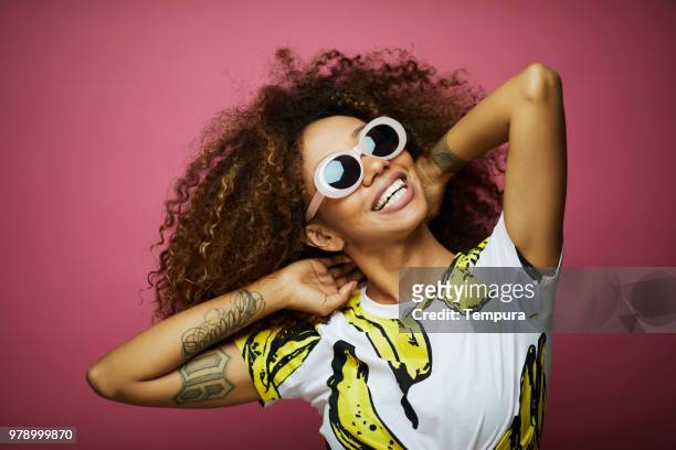 beautiful young woman with afro, summer time. - pop musician stock pictures, royalty-free photos & images