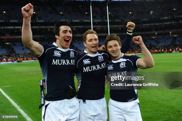 Kelly Brown, Dan Parks and Chris Cusiter of Scotland celebrate victory during the RBS Six Nations match between Ireland and Scotland at Croke Park on...