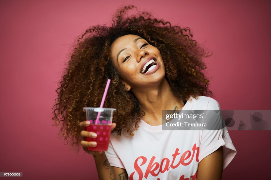 Beautiful young woman with afro, summer time.