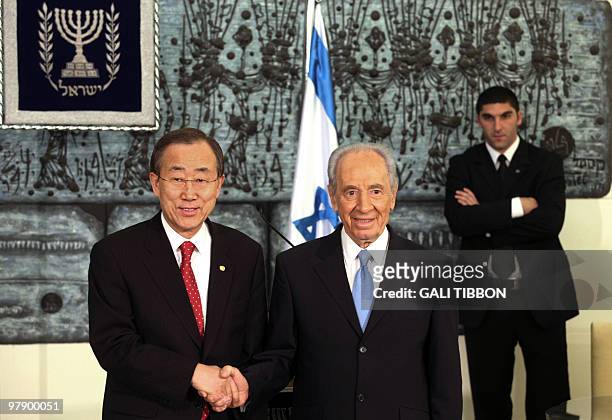 Secretary General Ban Ki-moon shakes hands with Israeli President Shimon Peres during their joint press conference at the presidential compound in...