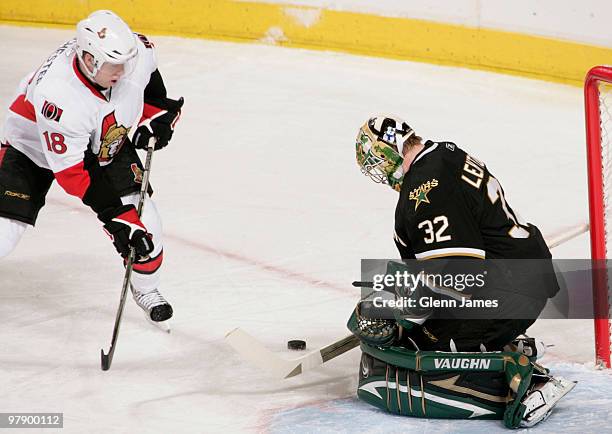 Kari Lehtonen of the Dallas Stars makes a stop against Jesse Winchester of the Ottawa Senators on March 20, 2010 at the American Airlines Center in...